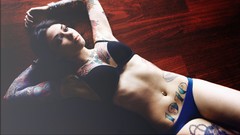 Woman tattoos lingerie models lying down nude