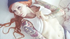 Woman tattoos lying down redheads panties no bra