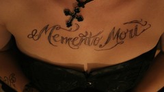 Woman tattoos memento