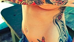 Woman tattoos models boobs