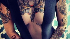 Woman tattoos models boobs