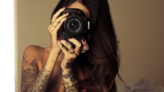Woman tattoos models boobs