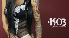 Woman tattoos models boobs