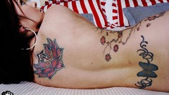 Woman tattoos nude boobs