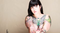 Woman tattoos nude strategic covering