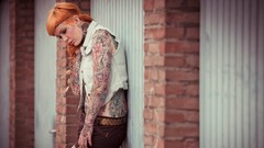 Woman tattoos orange hair