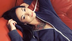 Woman tattoos piercings black hair