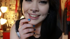 Woman tattoos piercings face expressions