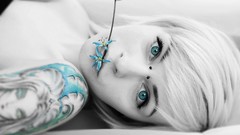Woman tattoos piercings selective coloring