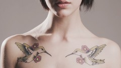 Woman tattoos piercings topless