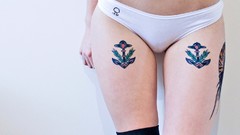 Woman tattoos piercings underwear