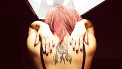 Woman tattoos pink hair