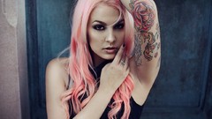 Woman tattoos pink hair