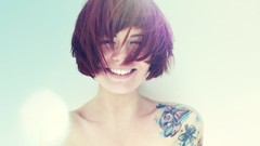 Woman tattoos smiling