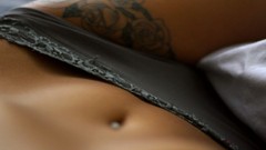 Woman tattoos thong