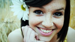 Woman teeth faces smiling brown eyes brunettes flower in hair