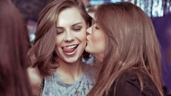 Woman tongue kissing closed eyes brunettes