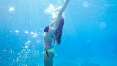 Woman underwater body models bikini