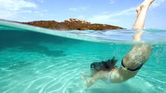 Woman underwater models split-view