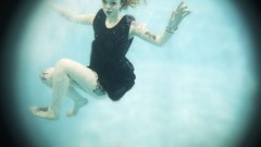 Woman underwater redheads pale skin Lass-model Julie Kennedy