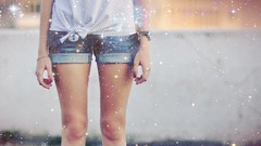 Woman watches legs sparkles denim shorts polka dots