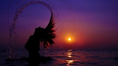 Woman water sun reflections