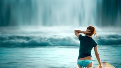 Woman waterfalls bikini surfboards