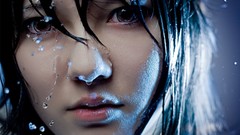 Woman wet faces water drops asians models