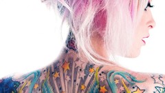 Woman white background faces tattoos pink hair
