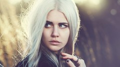 Woman white hair faces Ben Minor