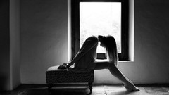 Woman window sitting monochrome near