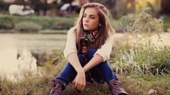 Woman wool jeans sitting earrings scarfs sweaters blue jeans