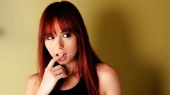 Woman yellow background redheads Ariel Rebel fingers on lips