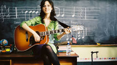 Woman zooey deschanel guitars