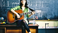 Woman zooey deschanel guitars