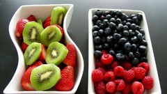 Yellow black red Green food kiwi strawberries fruits bowl
