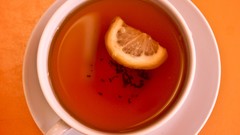 Yellow tea orange lemons cups