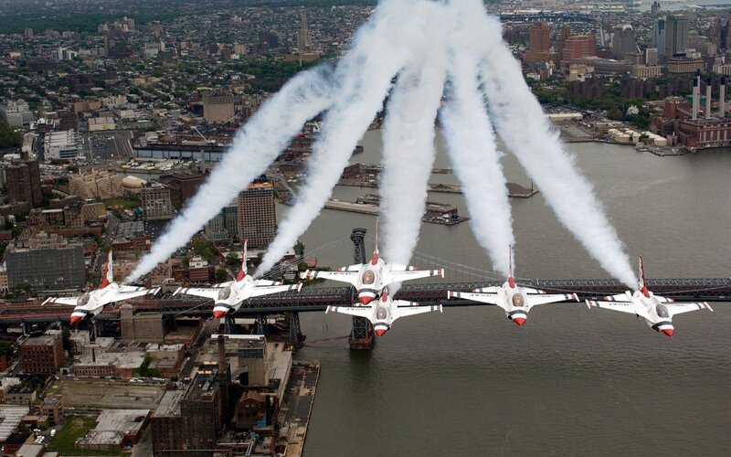 Thunderbirds fly over city