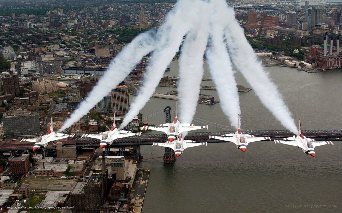 Thunderbirds fly over city