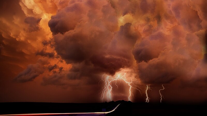 Thunderstorm over a dark landscape