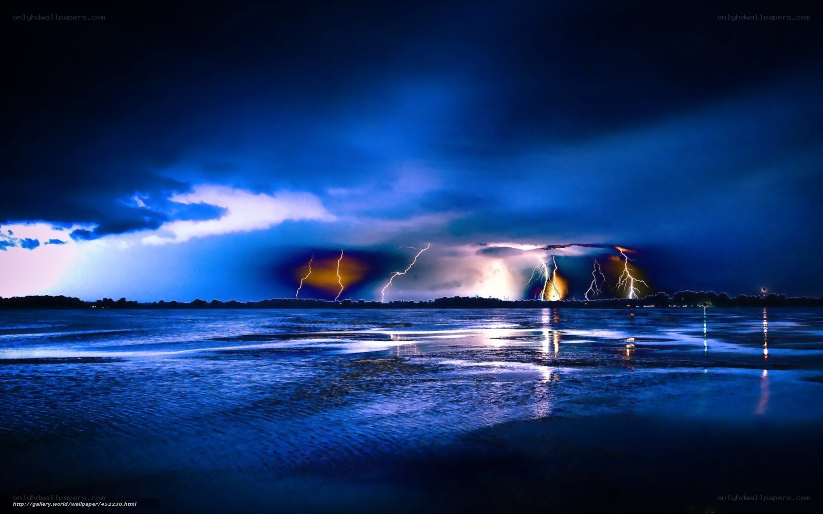 Thunderstorm over a lake at night