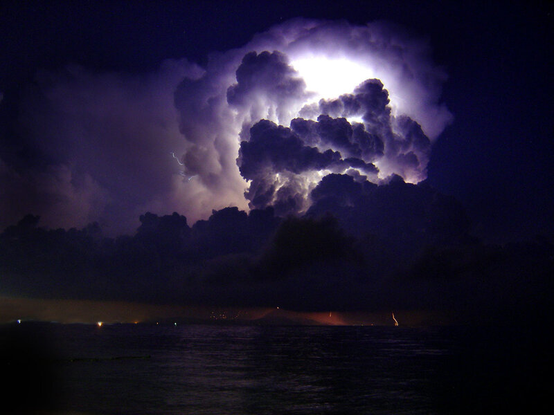 Thunderstorm over the ocean at night