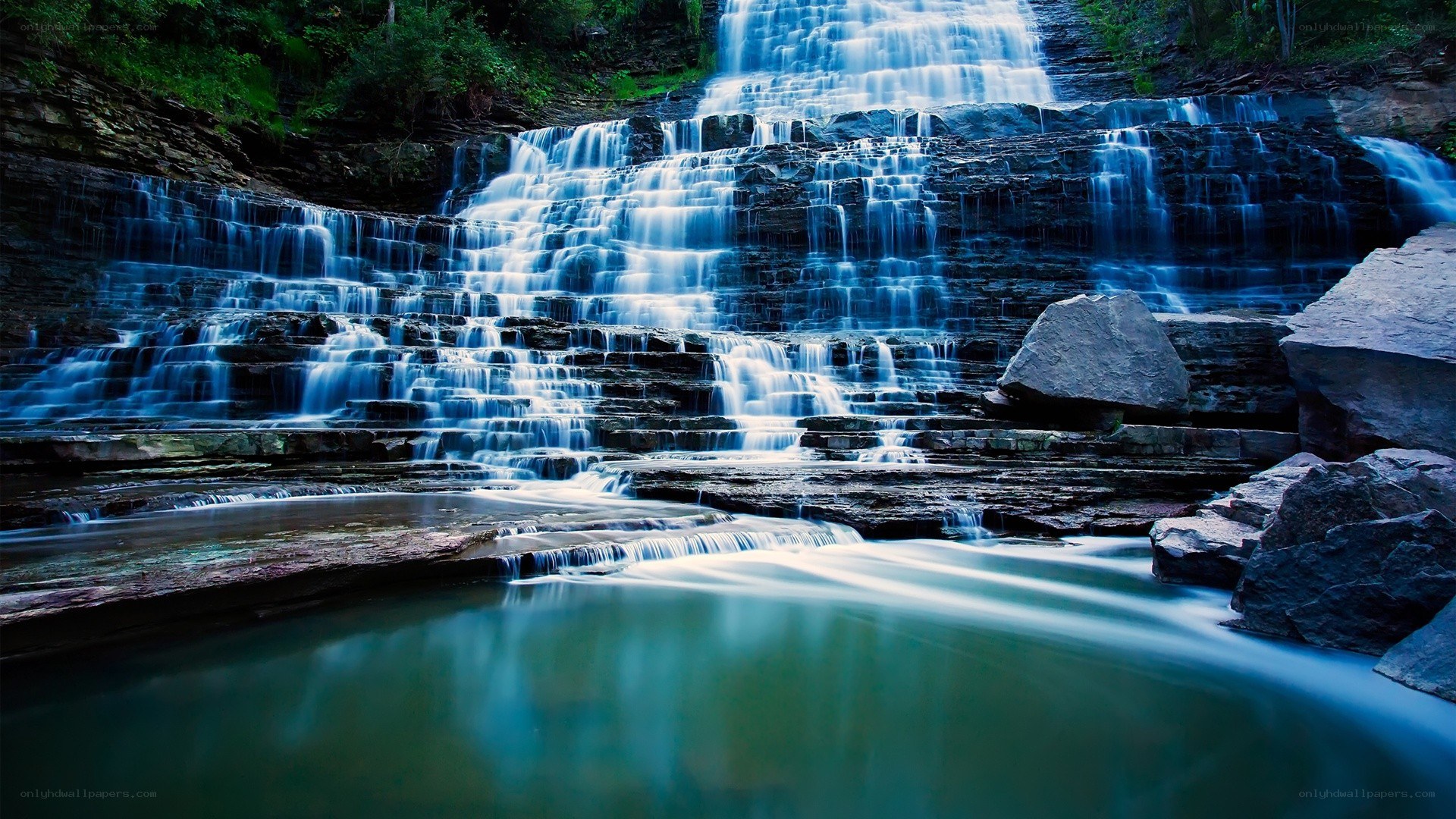 Tiered waterfall in forest
