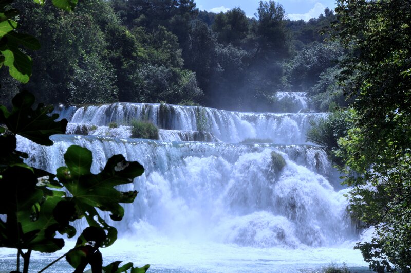 Tiered Waterfall in Forest — Green, Serene, Afternoon, Photograph, Trees, River, Mist