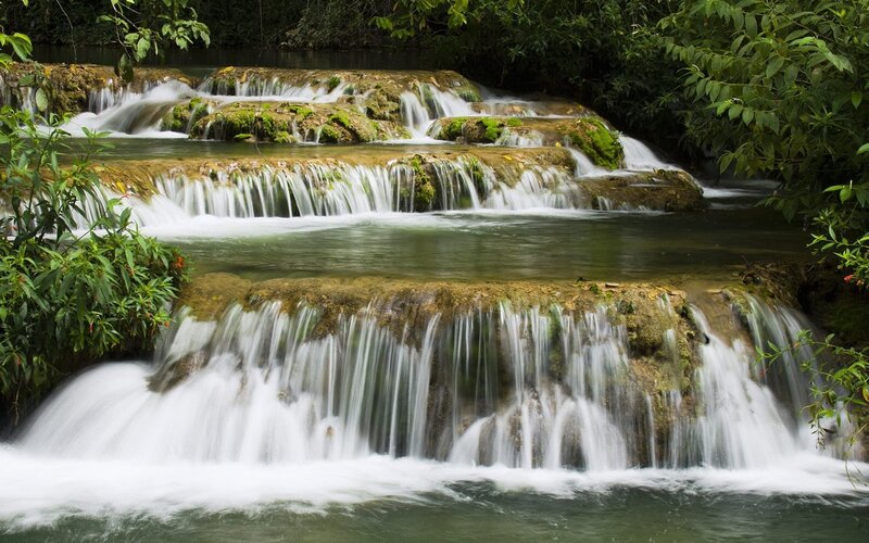 Tiered Waterfall in Forest — Green, Serene, Afternoon, Photograph, Trees, Rocks, River, Brown