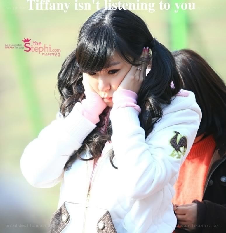 Tiffany covering her ears