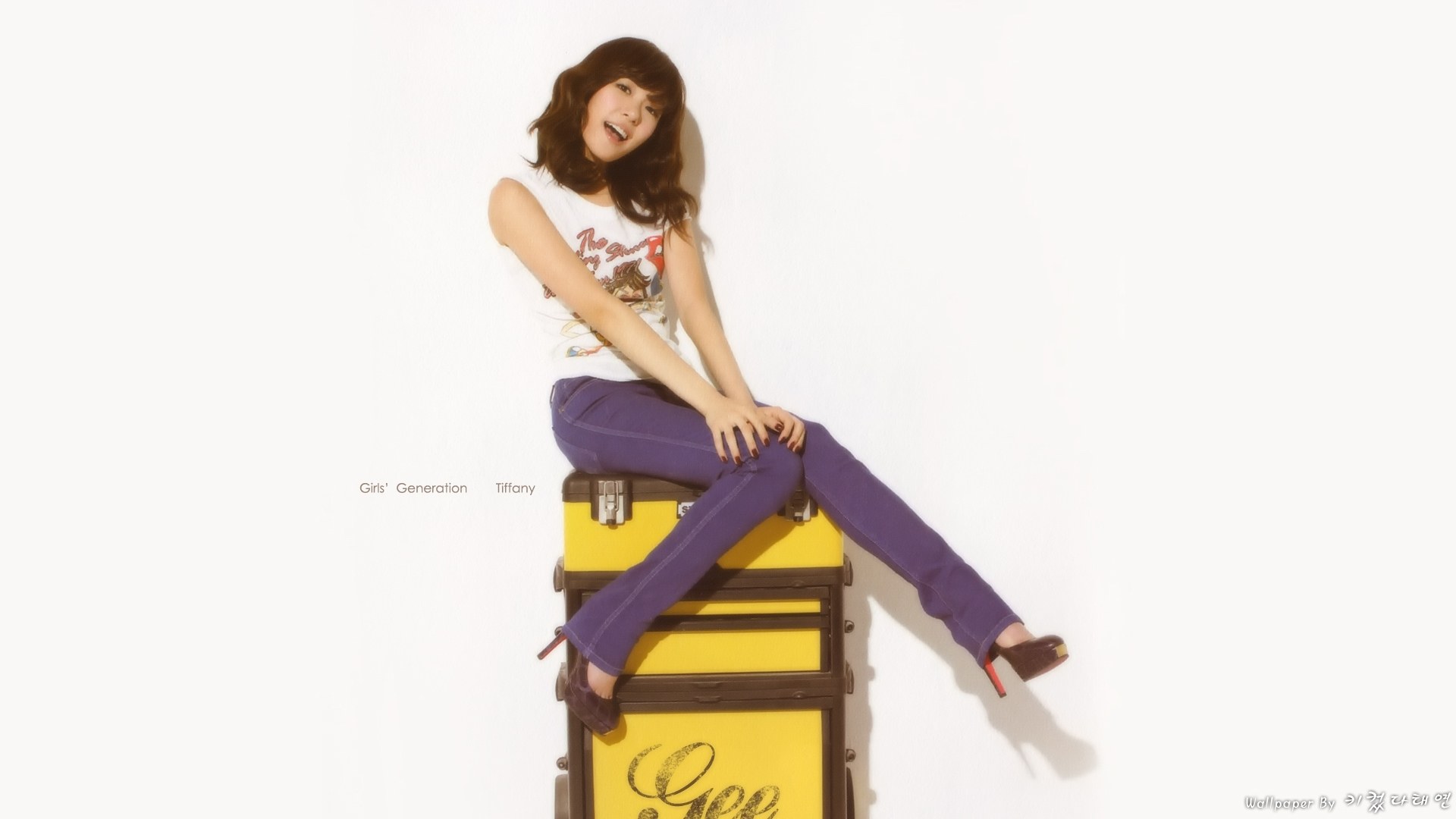 Tiffany sitting on a suitcase
