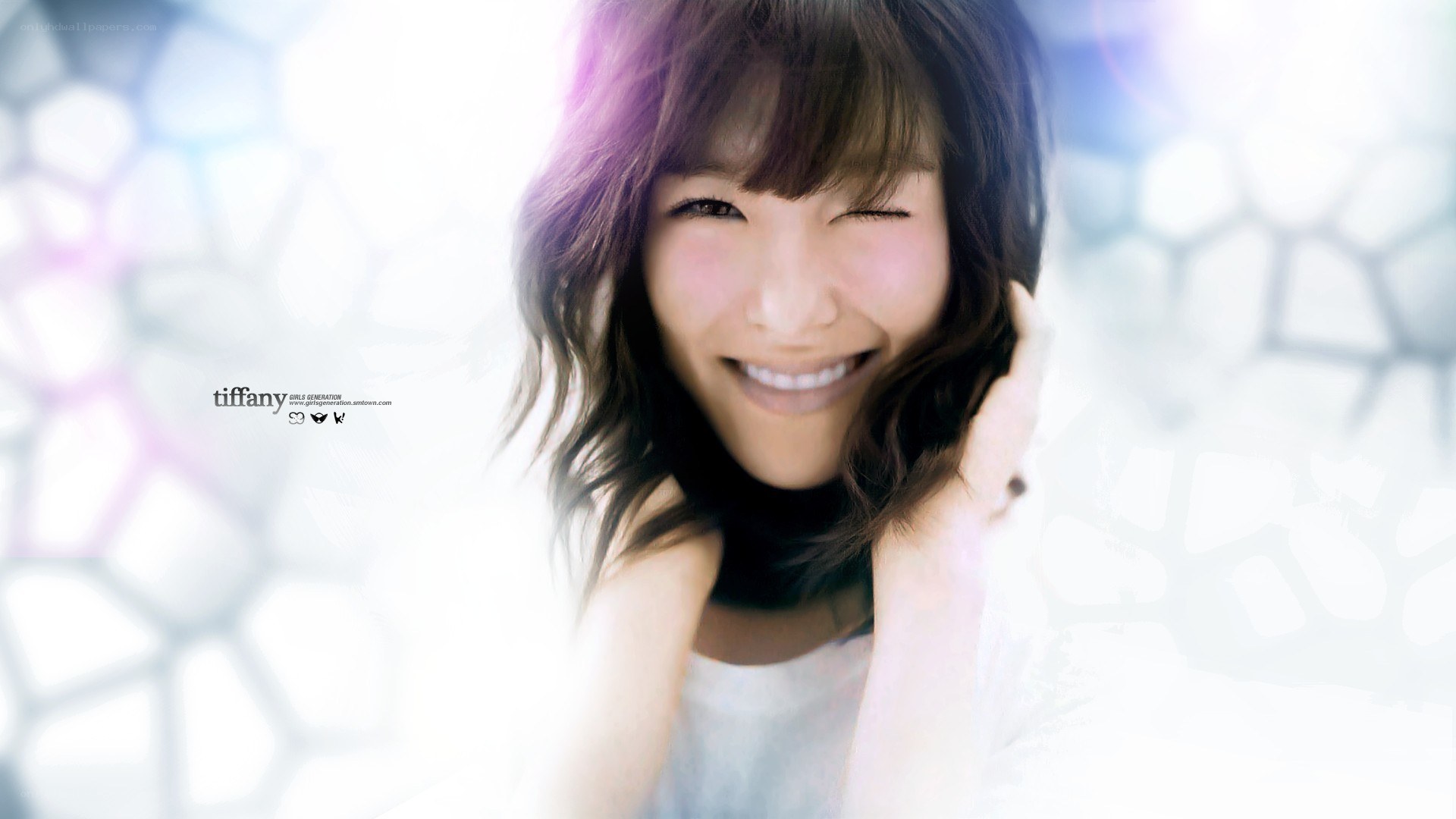 Tiffany smiling with one eye closed