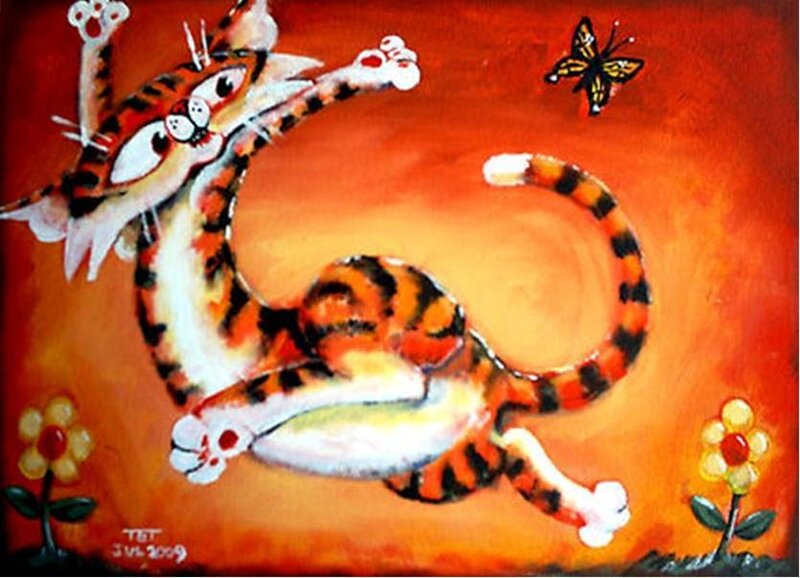 tiger cat chasing butterfly