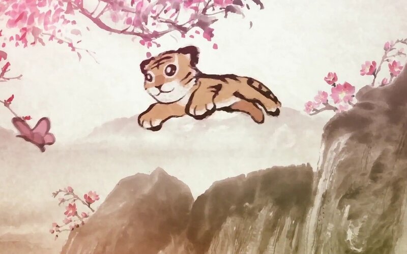 tiger cub in cherry blossoms
